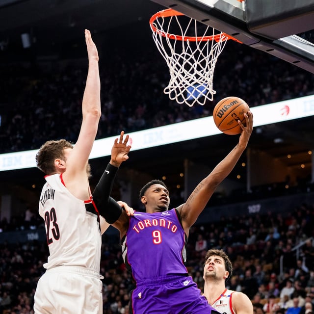 Toronto Raptors guard RJ Barrett (9) lays up the ball against Portland Trail Blazers centre Donovan Clingan (23) during the second half of NBA basketball action in Toronto on Thursday, April 3, 2025. THE CANADIAN PRESS/Thomas Skrlj
