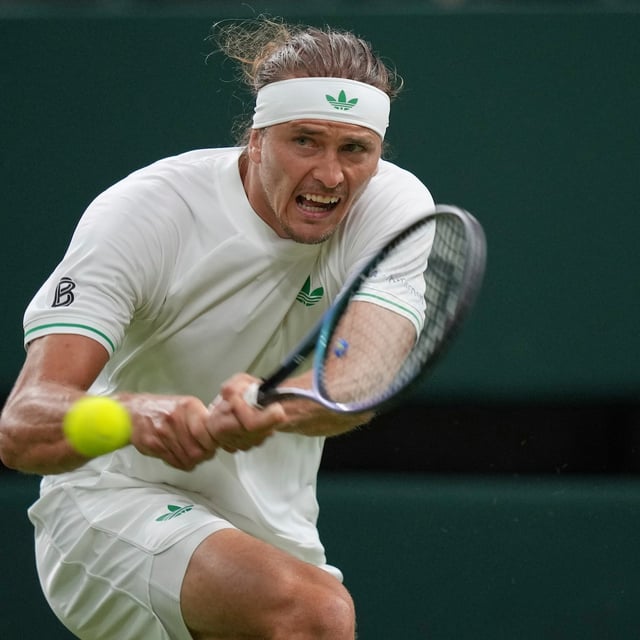 Alexander Zverev of Germany returns to Arthur Rinderknech of France in their first-round men's singles match at the Wimbledon Tennis Championships in London, Monday, June 30, 2025. (AP Photo/Alastair Grant)