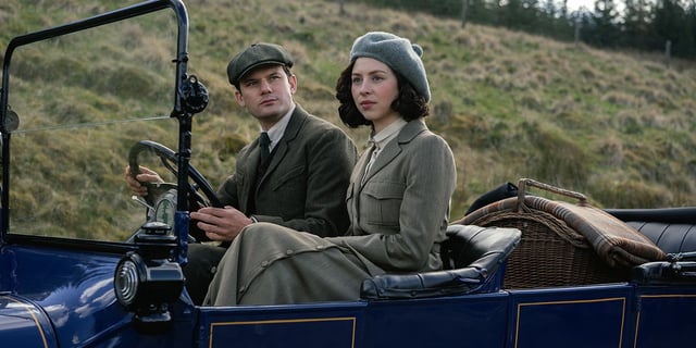 Hermione Corfield and Jeremy Irvine sitting in a car in Outlander Blood of My Blood