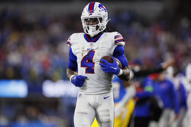 James Cook #4 of the Buffalo Bills carries the ball on a run play during an NFL football game against the Los Angeles Chargers at SoFi Stadium on December 23, 2023 in Inglewood, California.