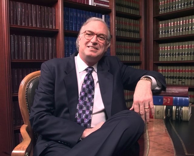 FILE - Attorney Roy Black poses in the law library of his Miami-based firm, Black, Srebnick &amp; Kornspan P.A., Black has developed a reputation as the go-to attorney for the famous and infamous, having successfully represented William Kennedy Smith, alleged cocaine kingpins Aug.o Falcón and Salvador Magluta, and most recently sportscaster Marv Albert in his forcible sodomy case in Virginia, which ended in a plea deal. (Michael Malone/South Florida Sun Sentinel)