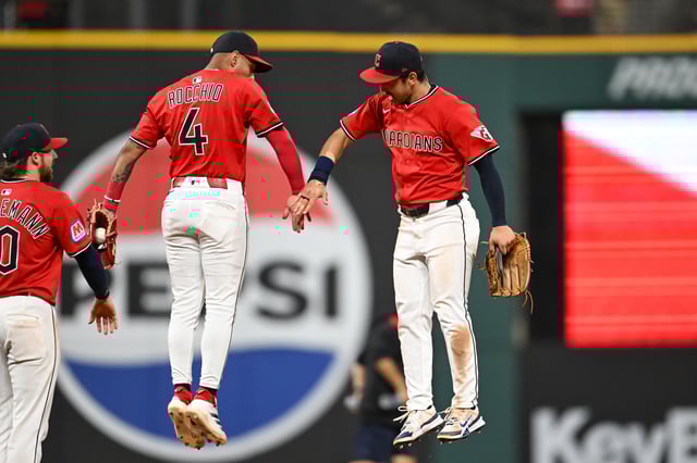 CLEVELAND, OHIO - JULY 21: Brayan Rocchio #4 and Steven Kwan #38 of the Cleveland Guardians celebrate their team&#39;s 10-5 win over the Baltimore Orioles at Progressive Field on July 21, 2025 in Cleveland, Ohio.