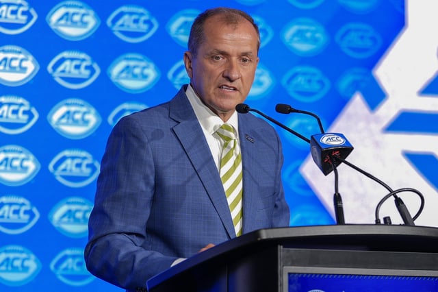Jul 22, 2025; Charlotte, NC, USA; ACC commissioner Jim Phillips speaks to the media during ACC Media Days at Hilton Charlotte Uptown. Mandatory Credit: Jim Dedmon-Imagn Images/File Photo