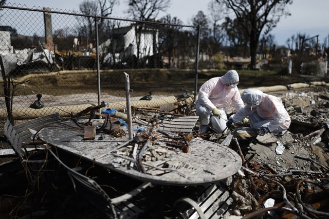 PACIFIC PALISADES, CALIFORNIA – MARCH 15: Volunteers with Samaritan’s Purse help homeowner Dennis Higgins (NOT PICTURED) search for meaningful personal items in the remains of his home which burned in the Palisades Fire on March 15, 2025 in Pacific Palisades, California. Higgins and his wife Nicole had lived in the home for about 30 years. Over 16,000 structures were destroyed in the Palisades and Eaton fires. (Photo by Mario Tama/Getty Images)