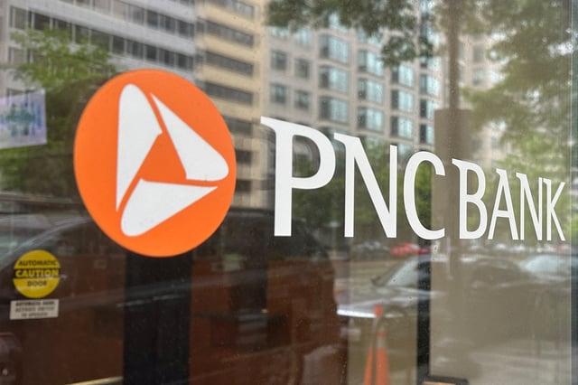 The logo of PNC Bank, a subsidiary of PNC Financial Services Group, is seen on the window of a branch in Washington, U.S. April 30, 2023.  REUTERS/Ashraf Fahim/File Photo