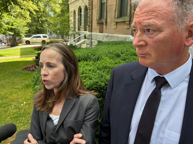 Crown attorney Sarah Kirby speaks with reporters while co-counsel Terry Nickerson looks on Tuesday after a Halifax youth court judge found a 17-year-old Dartmouth boy guilty of manslaughter for his involvement in a group assault that resulted in the fatal stabbing of 16-year-old Ahmad Maher Al Marrach in April 2024. 
