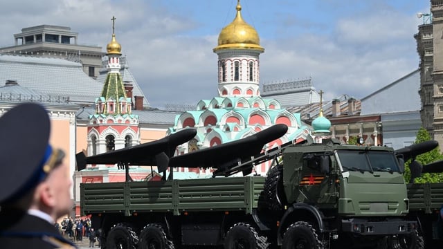 Trucks carrying Geran-2 drones are shown during a Victory Day military parade in central Moscow on May 9. The Russian army's TV channel recently aired footage of what it said was a factory with finished Geran-2 drones shown inside.
