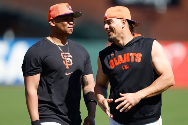 San Francisco Giants’ Rafael Devers (16) chats with San Francisco Giants’ Willy Adames (2) before their game against the Cleveland Guardians at Oracle Park in San Francisco, Calif., on Tuesday, June 17, 2025. (Nhat V. Meyer/Bay Area News Group)