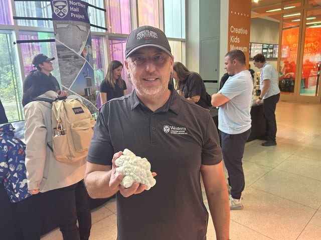 Julian Brimelow, executive director of the Northern Hail Project, displays a 3D replica of a near record hailstone collected in 2022, at the Telus Spark Science Centre in Calgary, on Tuesday, July 22, 2025. THE CANADIAN PRESS/Bill Graveland