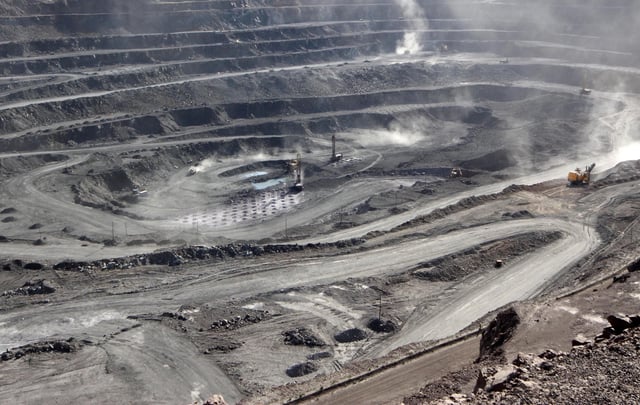 Miners are seen at the Bayan Obo mine containing rare earth minerals, in China's Inner Mongolia in 2011.
