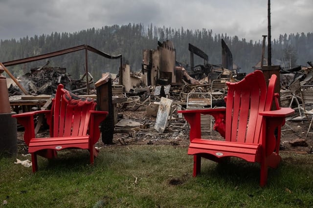 Melted chairs are shown outside of the burned Maligne Lodge after wildfires encroached into Jasper, Alta., on Friday, July 26, 2024. 