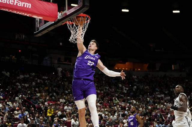 Jul 14, 2025; Las Vegas, NV, USA;  Utah Jazz forward Kyle Filipowski (22) dunks the ball against the San Antonio Spurs during the first half of a NBA basketball game at the Thomas & Mack Center. Mandatory Credit: Lucas Peltier-Imagn Images/File Photo