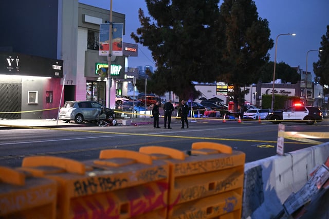Officers stand at the scene near The Vermont music venueafter a vehicle drove into a crowd in Hollywood in the early hours of July 19, 2025, injuring 28 people, according to the Los Angeles Fire Department. More than 100 firefighters responded to the scene in East Hollywood assisting three patients in critical condition, six in serious condition and 19 listed as fair, the Fire Department said. The cause of the crash incident was not immediately known.