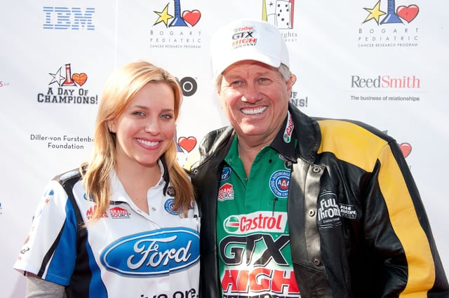 Race car drivers Brittany Force (L) and John Force arrive at the Yahoo! Sports Presents A Day Of Champions event at the Sports Museum of Los Angeles on November 6, 2011 in Los Angeles, California.