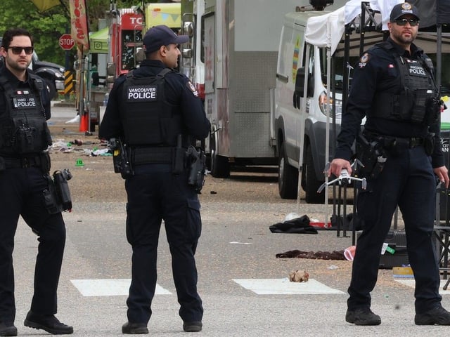 Vancouver police with a drone on the scene where at least twelve people were killed by a speeding vehicle on Fraser St during Lapu Lapu Day celebrations  in Vancouver April 27, 2025.