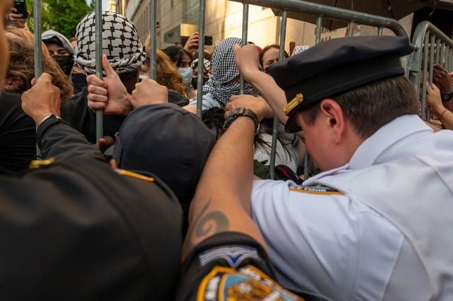 Police push back protesters as they gather outside of Columbia University's Butler Library in New York, after pro-Palestinian protesters occupied the space on May 7, 2025.