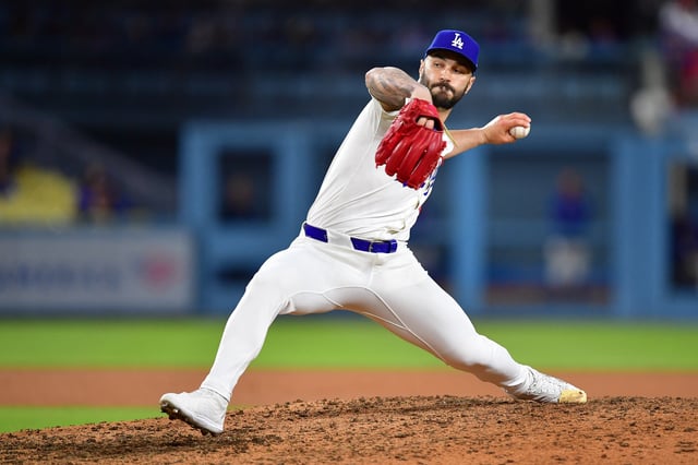 Jul 21, 2025; Los Angeles, California, USA; Los Angeles Dodgers pitcher Tanner Scott (66) throws against the Minnesota Twins during the eighth inning at Dodger Stadium. Mandatory Credit: Gary A. Vasquez-Imagn Images/File Photo