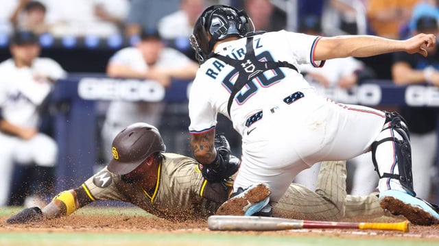 Miami Marlins catcher Agustin Ramirez (50) tags out the San Diego Padres’ Luis Arraez in the sixth inning at loanDepot park on Tuesday, July 22, 2025, in Miami. (Megan Briggs/Getty Images/TNS)