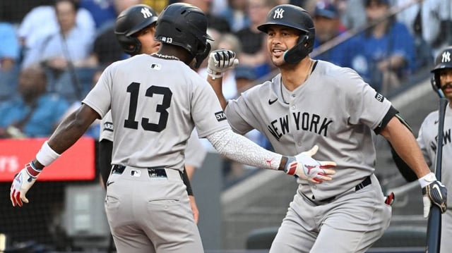 Jul 22, 2025; Toronto, Ontario, CAN;   New York Yankees designated hitter Giancarlo Stanton (27) greets second baseman Jazz Chisholm Jr. (13) who hit a three run home run against the Toronto Blue Jays in the first inning at Rogers Centre. Mandatory Credit: Dan Hamilton-Imagn Images