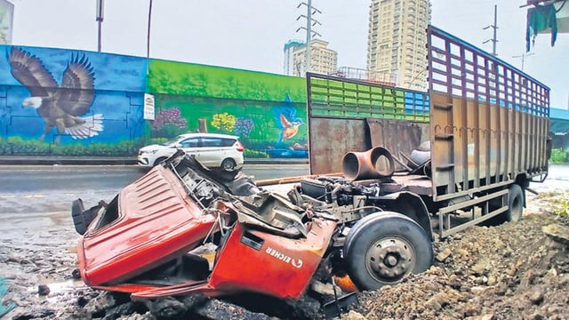 Thane, India - July -22, 2025:Two killed in accident on Thane Ghodbunder Road, A truck carrying iron pipes from Navi Mumbai to Gujarat crashed into a divider on Ghodbunder Road Patlipada Bridge after the driver lost control of the vehicle. In this accident, both the driver and the cleaner were stuck on the track But both of them died in this accident .,in Thane,in Mumbai, India, on, Tuesday, July -22, 2025. ( Praful Gangurde / HT Photo ) (praful Gangurde)