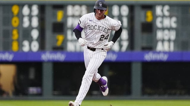 Jul 22, 2025; Denver, Colorado, USA;Colorado Rockies third baseman Ryan McMahon (24) runs off a three run home run in the fourth inning against the St. Louis Cardinals at Coors Field. Mandatory Credit: Ron Chenoy-Imagn Images