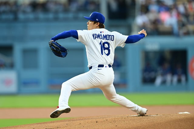 Yoshinobu Yamamoto #18 of the Los Angeles Dodgers pitches against the San Francisco Giants at Dodger Stadium on June 13, 2025 in Los Angeles, California.
