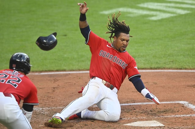Jul 21, 2025; Cleveland, Ohio, USA; Cleveland Guardians third baseman Jose Ramirez (11) scores in the fourth inning against the Baltimore Orioles at Progressive Field. Mandatory Credit: David Richard-Imagn Images/File Photo