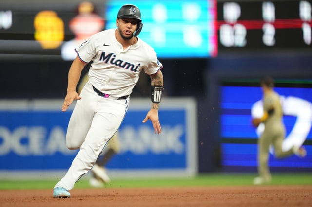 Jul 22, 2025; Miami, Florida, USA;  Miami Marlins catcher Agustín Ramírez (50) rounds third and scores a run in the first inning against the San Diego Padres at loanDepot Park. Mandatory Credit: Jim Rassol-Imagn Images