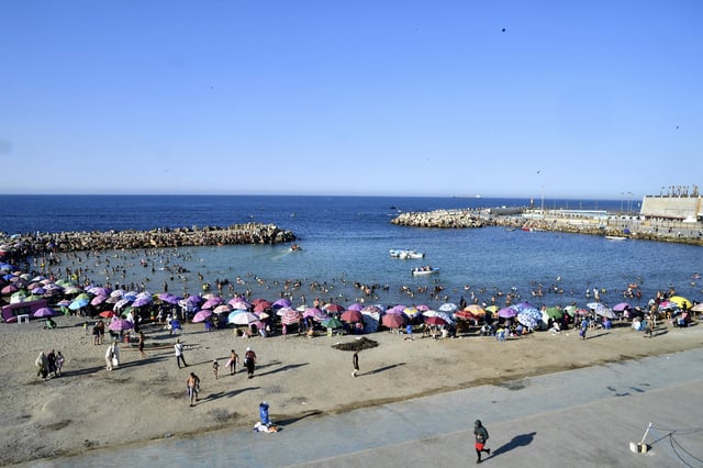 People enjoy the beach in Algiers, Friday, July 18, 2025. (AP Photo/Fateh Guidoum)