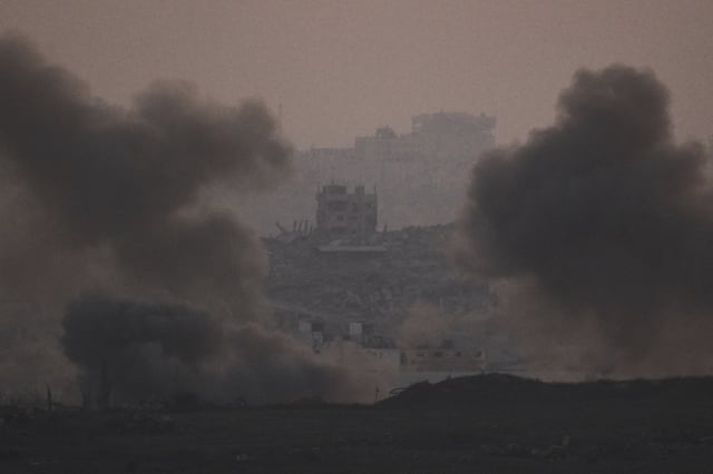Smokes rises after an explosion during Israeli air and ground operations in the Gaza Strip as seen from southern Israel, Tuesday, July 22, 2025. (AP Photo/Leo Correa)
