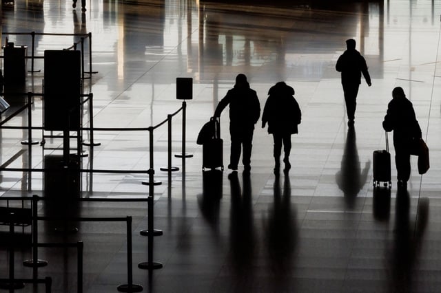 People walk in the departures hall at Beijing Capital International Airport, in Beijing, China, on January 8, 2023.
