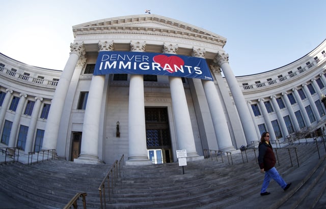 A banner to welcome immigrants is placed over the main entrance to the Denver City and County Building in Denver on Feb. 26, 2018.