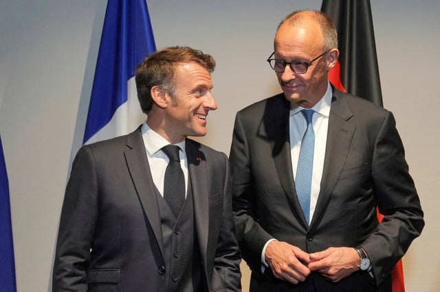 French President Emmanuel Macron speaks with Germany's Chancellor Friedrich Merz, at a hotel prior to an E3 meeting on the sidelines of the NATO summit in The Hague, Netherlands, June 24, 2025. Kin Cheung/Pool via REUTERS/File Photo