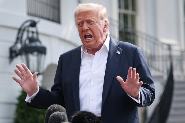 President Donald Trump answers questions while departing the White House with first lady Melania Trump on July 11, 2025, in Washington, D.C.