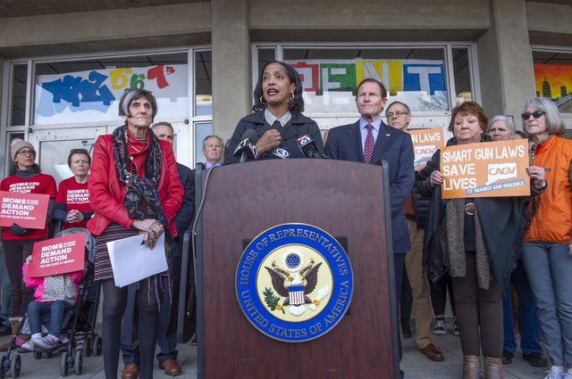 WATERBURY, CT - 03.19.2019 - GUN PRESS CONFERENCE - &#34;Federal funds should not be used to arm school personnel,? says U.S. Representative Jahana Hayes (CT-05), a member of the U.S. House Education and Labor Committee, at the front entrance of John F. Kennedy High School in Waterbury where she was a history teacher. Hayes spoke at a press conference at the school with U.S. Senator Richard Blumenthal (D-Conn.), at right, U.S. Representative Rosa DeLauro (CT-03), at left, educators and students after introducing legislation to keep guns out of classrooms. The legislation clarifies that the U.S. Department of Education cannot allow school districts to use federal funds for the purpose of arming teachers. Last year, reports indicated that Secretary of Education Betsy DeVos would no longer prohibit school districts from using federal funds to purchase firearms or provide firearms training for teachers. Hayes introduced H.Res.231 ? Keeping Guns Out of Classrooms ? in the House, and U.S. Senator Chris Murphy (D-Conn.) introduced the counterpart legislation in the Senate. PATRICK RAYCRAFT | praycraft@courant.com