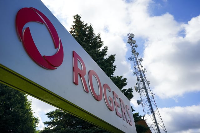 Rogers Communications Inc. reported its second-quarter profit declined compared with a year ago as a result of higher restructuring, acquisition and other costs. Rogers Communications signage is pictured in Ottawa on Tuesday, July 12, 2022. THE CANADIAN PRESS/Sean Kilpatrick