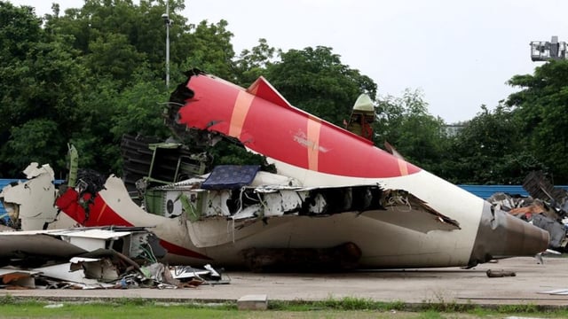Wreckage of the Air India Boeing 787-8 Dreamliner plane sits on the open ground, outside Sardar Vallabhbhai Patel International Airport, where it took off and crashed nearby shortly afterwards, in Ahmedabad.