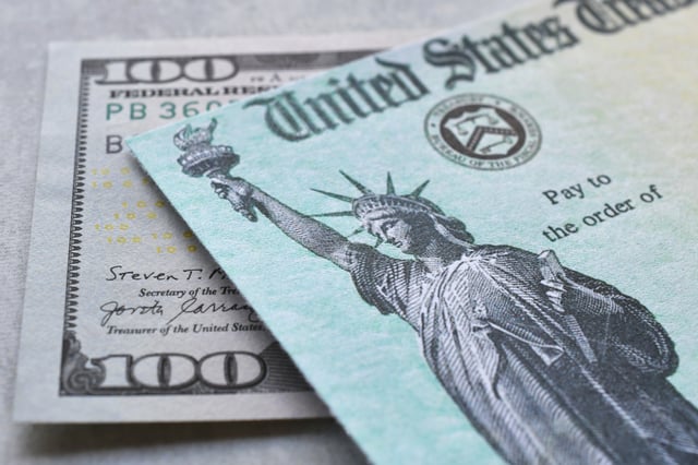 Stock image/file photo: U.S. Dollars with a Treasury check.