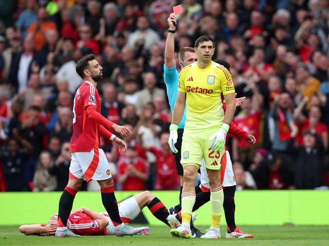 Soccer Football - Premier League - Manchester United v Aston Villa - Old Trafford, Manchester, Britain - May 25, 2025
Aston Villa's Emiliano Martinez is shown a red card by referee Thomas Bramall Action Images via Reuters/Craig Brough EDITORIAL USE ONLY. NO USE WITH UNAUTHORIZED AUDIO, VIDEO, DATA, FIXTURE LISTS, CLUB/LEAGUE LOGOS OR 'LIVE' SERVICES. ONLINE IN-MATCH USE LIMITED TO 120 IMAGES, NO VIDEO EMULATION. NO USE IN BETTING, GAMES OR SINGLE CLUB/LEAGUE/PLAYER PUBLICATIONS. PLEASE CONTACT YOUR ACCOUNT REPRESENTATIVE FOR FURTHER DETAILS..