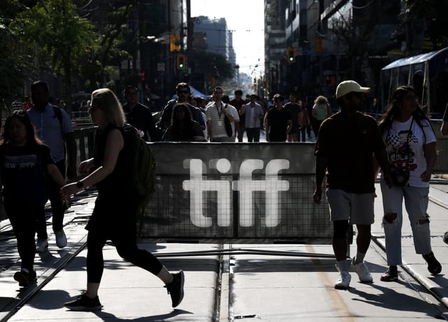 People walk the closed-off streets at the Toronto International Film Festival, in Toronto, Thursday, Sept. 7, 2023. THE CANADIAN PRESS/Nathan Denette