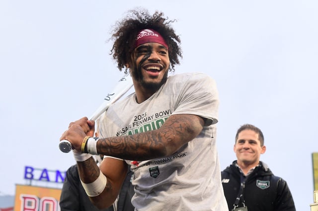 Dec 28, 2023; Boston, MA, USA; Boston College Eagles quarterback Thomas Castellanos (1) celebrates with the MVP award after being being named offensive MVP at the Wasabi Fenway Bowl against the Southern Methodist Mustangs at Fenway Park. Mandatory Credit: Eric Canha-USA TODAY Sports