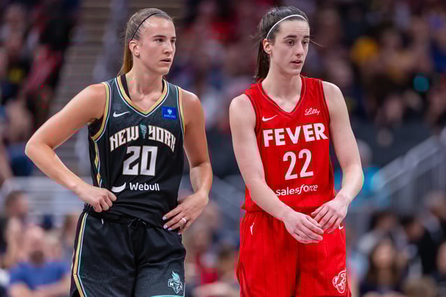 Caitlin Clark #22 of the Indiana Fever and Sabrina Ionescu #20 of the New York Liberty talk during the game at Gainbridge Fieldhouse on July 6, 2024 in Indianapolis, Indiana.