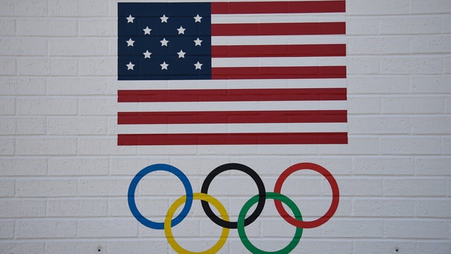 OKLAHOMA CITY, OK – JUNE 07: A detail view of a United States Olympic Committee (USOC) logo outside Devon Park on June 7, 2025, in Oklahoma City, OK. Devon Park is the world’s largest softball stadium, the permanent venue for the NCAA Women’s College World Series, USA Softball headquarters, National Softball Hall of Fame, and will be the softball venue for the Los Angeles 2028 Olympics. (Photo by Erica Denhoff/Icon Sportswire via Getty Images)
