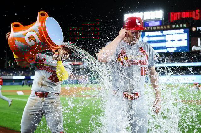 Erick Fedde #12 of the St. Louis Cardinals is doused with water by Iván Herrera #48 after pitching a complete game shutout against the Washington Nationals at Nationals Park on May 9, 2025 in Washington, DC.