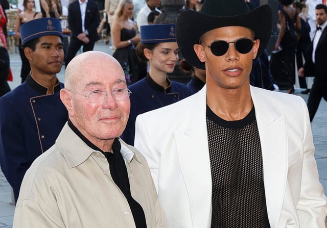 Producer David Geffen and Donovan Michaels pose during a photocall upon arrival to attend the spring/summer 2025 menswear ready to wear joint fashion show hosted by Vogue World as part of Paris Fashion Week at Place Vendome in Paris, on June 23, 2024, ahead of the Paris 2024 Olympic Games.