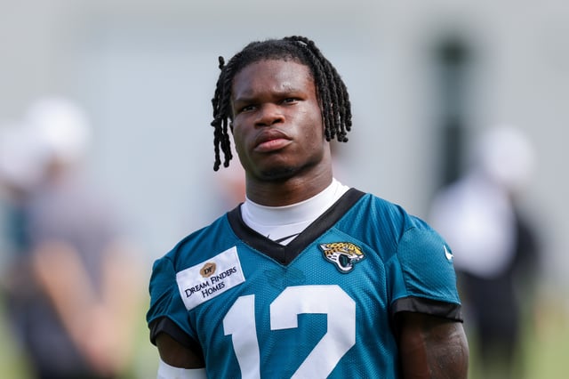 Jul 23, 2025; Jacksonville, FL, USA; Jacksonville Jaguars wide receiver Travis Hunter (12) looks on after training camp at Miller Electric Center. Mandatory Credit: Nathan Ray Seebeck-Imagn Images/File Photo