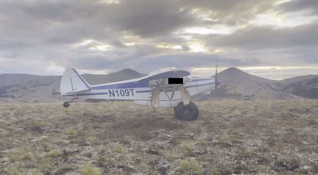 The Piper PA-18 plane the NTSB determined was overloaded with moose meat and antlers when it took on September 12, 2023, seen in a still image from bystander video reviewed by the NTSB in their report. A portion of this image has been obscured by the NTSB.
