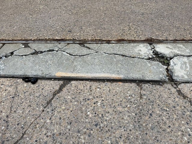 Damaged sections of 4 Street S.W. sidewalk on July 23, 2025 in Calgary, Alberta that were marked for repair months go but never fixed. Photo by Don Braid