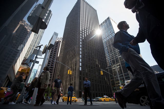 Pedestrians walk past CBS Corp. headquarters in New York, U.S., on Saturday, April 30, 2016.