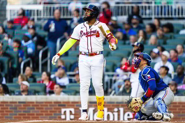 ATLANTA, GA - APRIL 21: Marcell Ozuna #20 of the Atlanta Braves hits a home run in the first inning against the Texas Rangers at Truist Park on April 21, 2024 in Atlanta, Georgia.